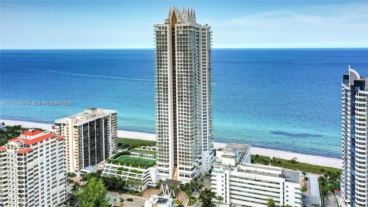 Oceanfront high-rise building featuring multiple balconies