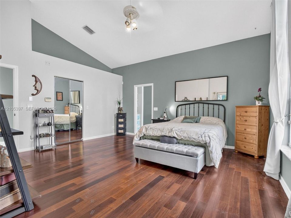 Vaulted ceilings in this expansive primary bedroom