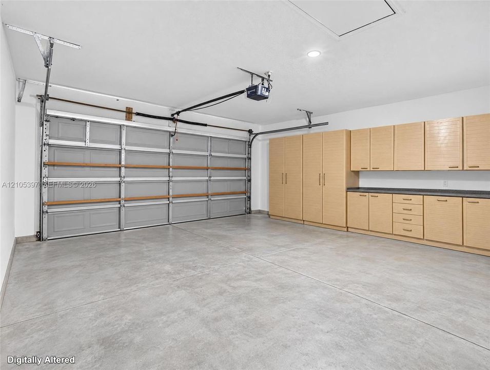 Garage featuring concrete flooring, VIRTUALLY STAGED