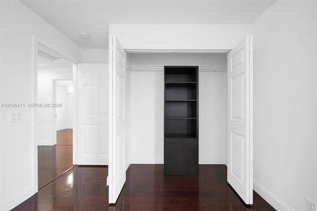 Rich wood-finish flooring with crisp white walls