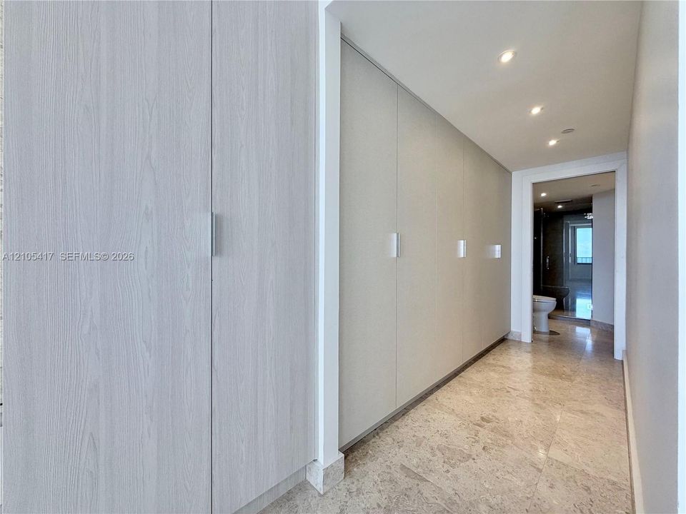 Built-in cabinetry with light wood-finish doors and sleek hardware