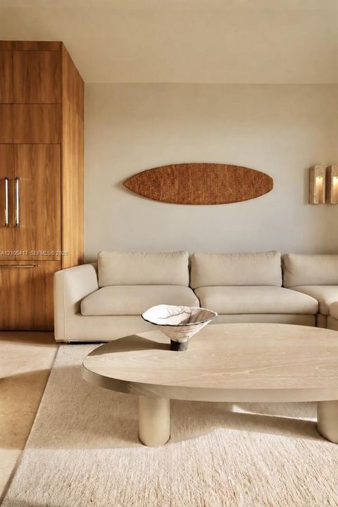 Built-in wood-finish cabinetry, neutral wall color, and wall-mounted sconces
