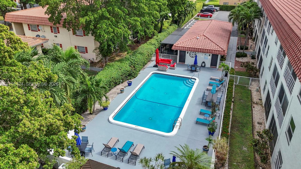 Rectangular swimming pool with a surrounding paved deck