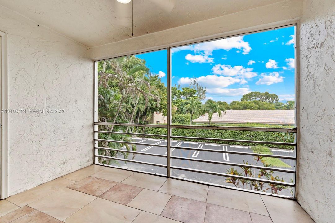 Private outdoor balcony with a light-toned tile floor