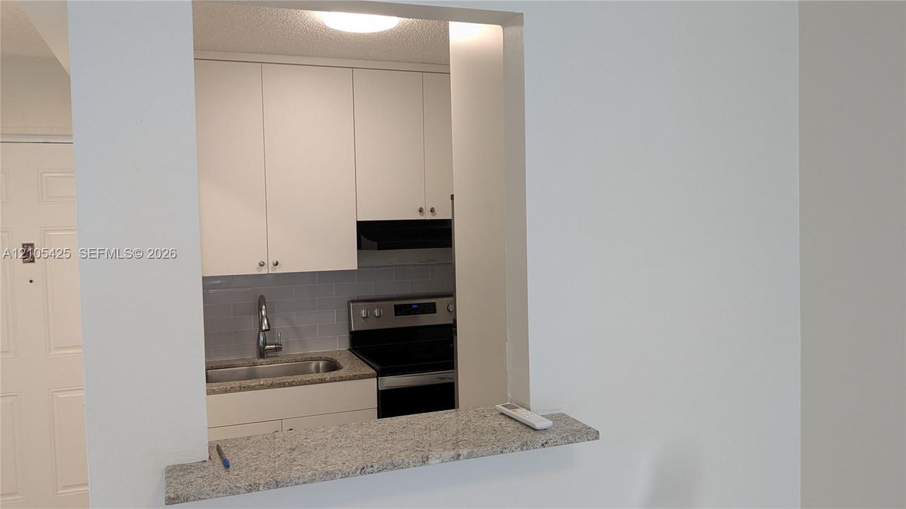 Kitchen pass-through with granite countertop