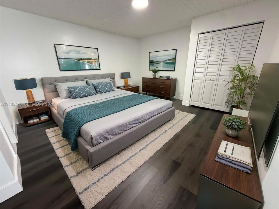 Bedroom featuring dark-toned wood-finish flooring, a white tongue-and-groove plank ceiling, and dual floor-to-ceiling closets with white louvered doors
