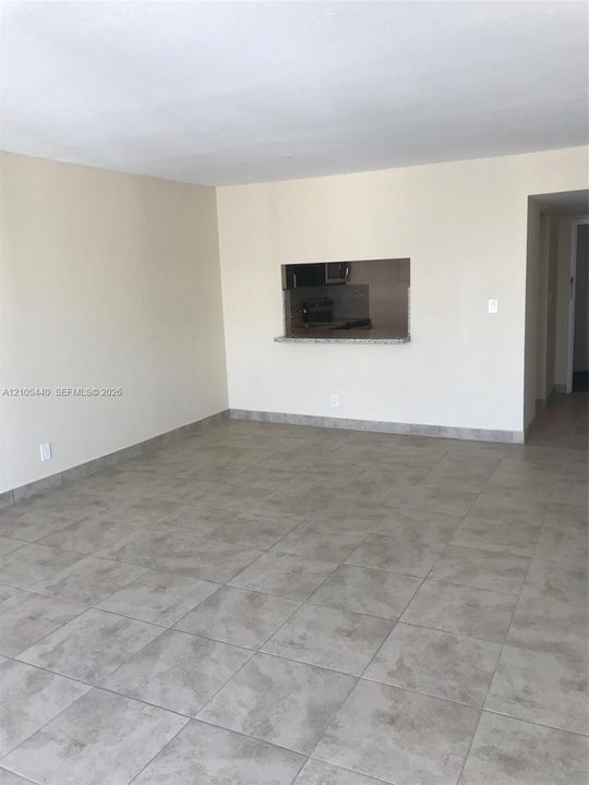 Neutral-toned tile flooring throughout