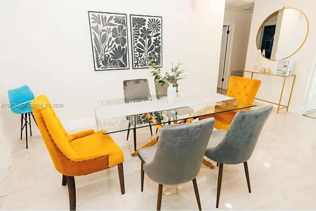Large-format polished tile flooring throughout
