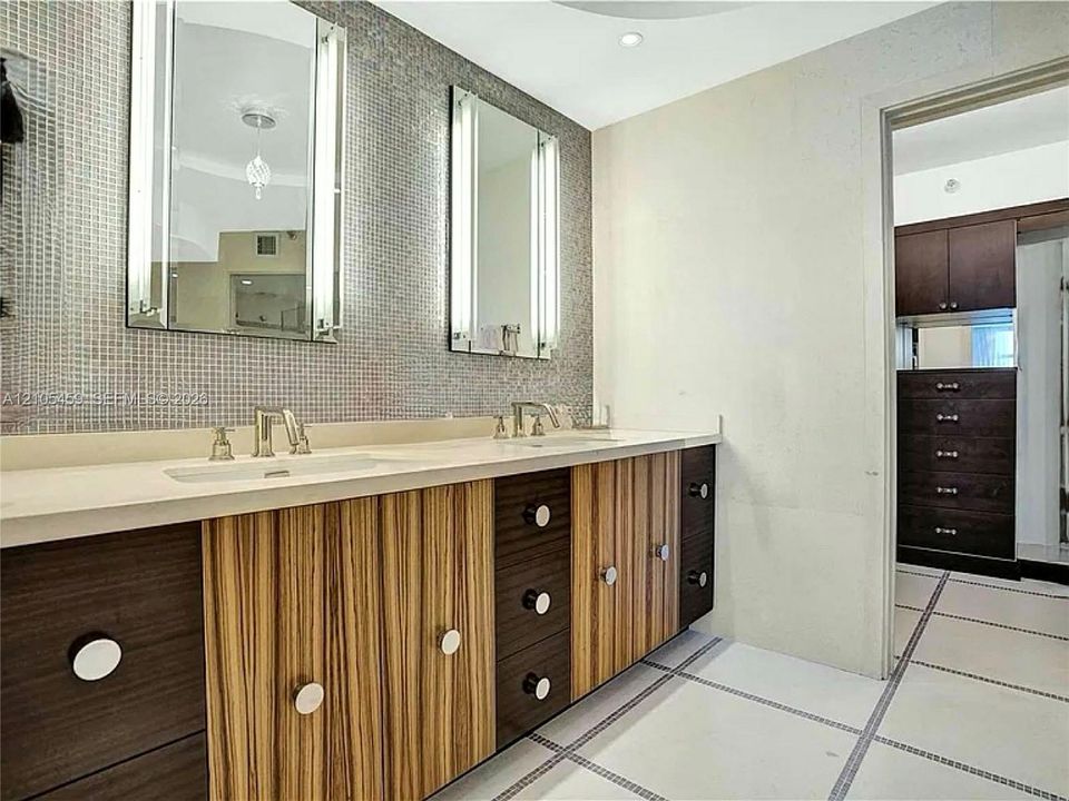 Double vanity with integrated sinks and stone countertop