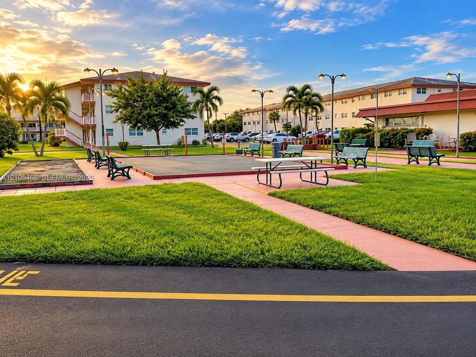 Expansive green spaces with paved walkways and mature palm trees