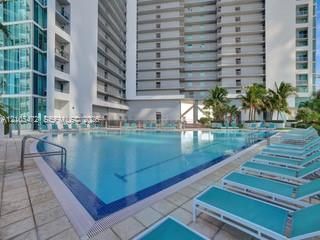 Expansive swimming pool with integrated lane lines and a surrounding deck