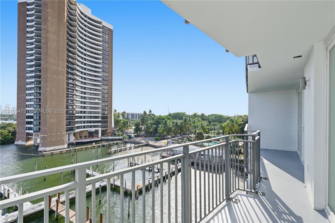 Private balcony with metal railings and water access