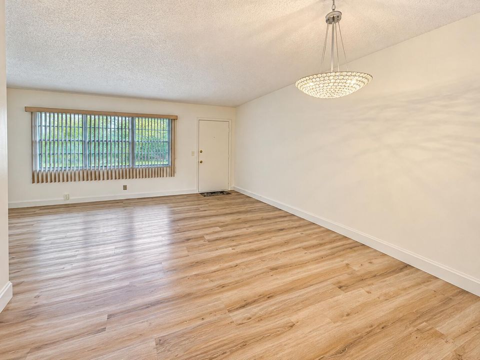 Bright Empty Living Room with Crystal Ch