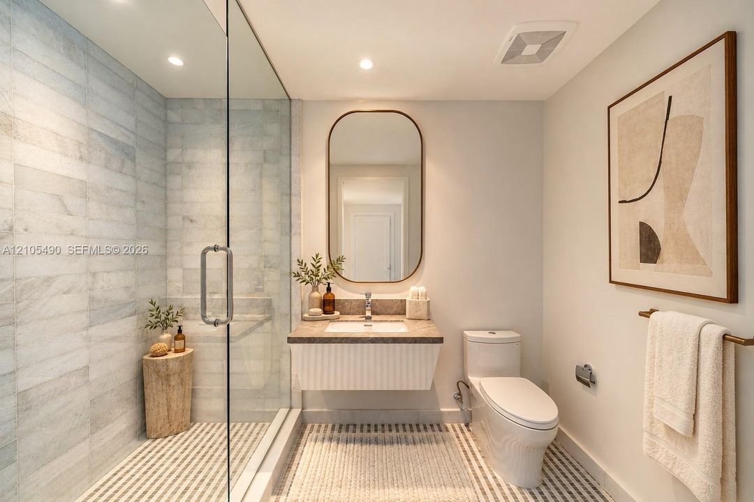 Glass-enclosed shower with horizontal wall tile, floating vanity with a stone countertop, integrated sink, and an arched wall mirror