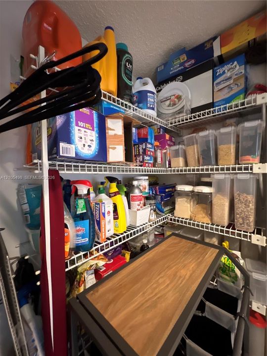 Well organized pantry and table to fold clothes or other activities