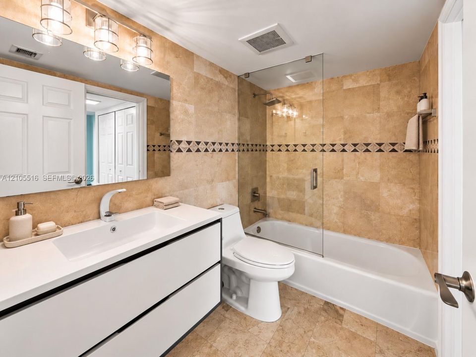 Light-toned tiled flooring and walls