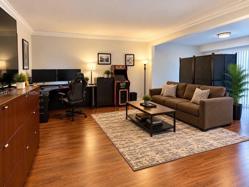 Wood-finish flooring, crown molding, and recessed ceiling lighting