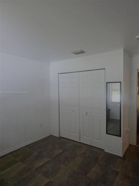 White bi-fold doors with panel detailing
