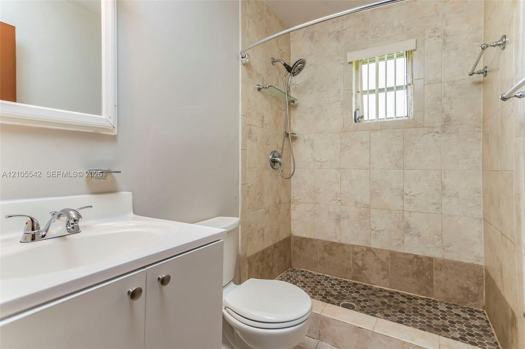 Vanity with integrated sink and chrome faucet