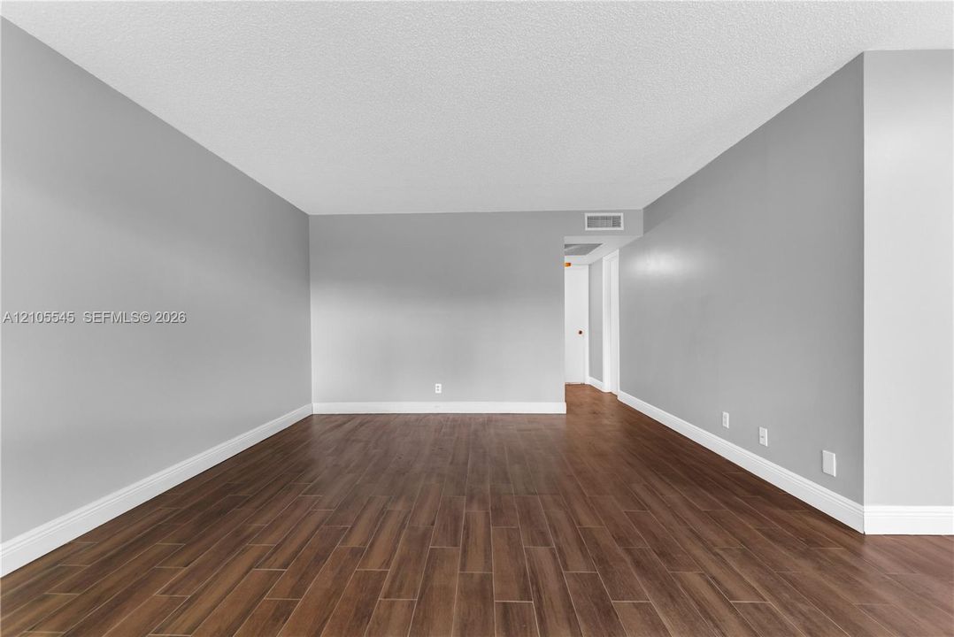 Wood-finish plank tile flooring throughout