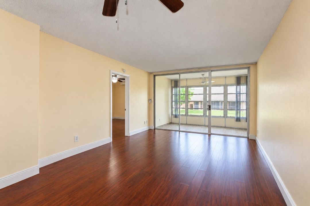 Sunlit Empty Living Room with Lanai
