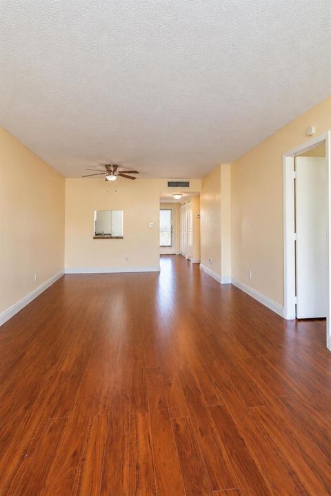 Empty Beige Living Room with Wood Floors