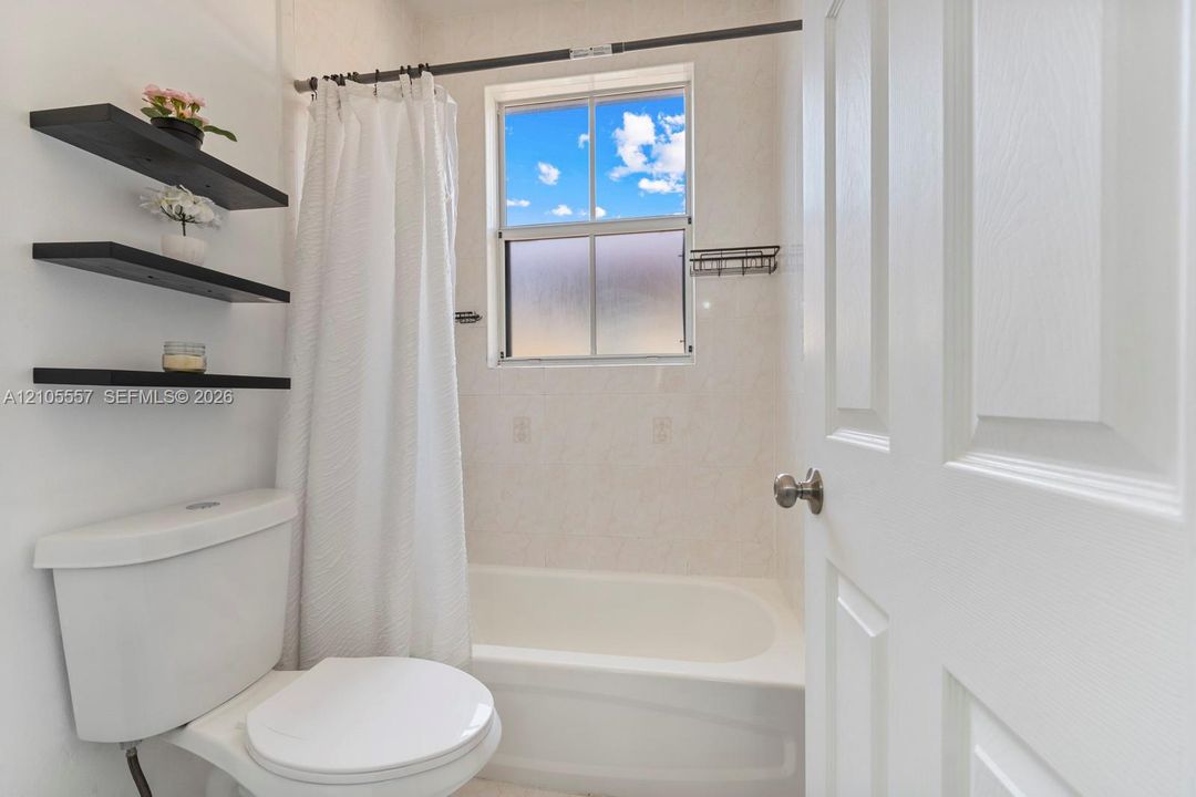 White paneled door with brushed nickel hardware
