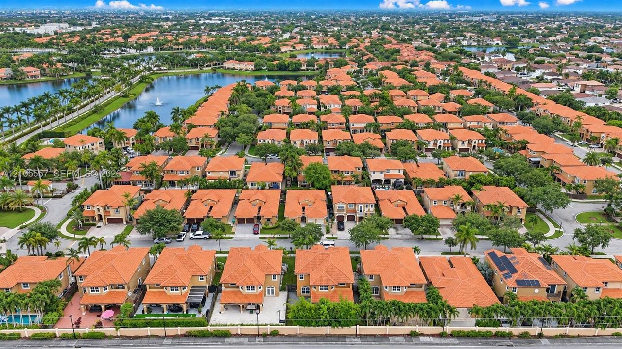 Aerial perspective showcasing a residential community with uniform terracotta roofs