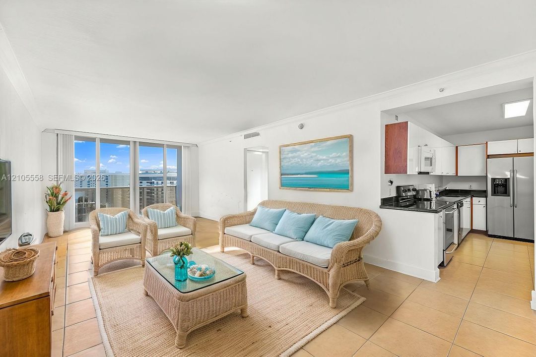 Floor-to-ceiling windows, tile flooring, crown molding, open-concept kitchen, and stainless steel appliances