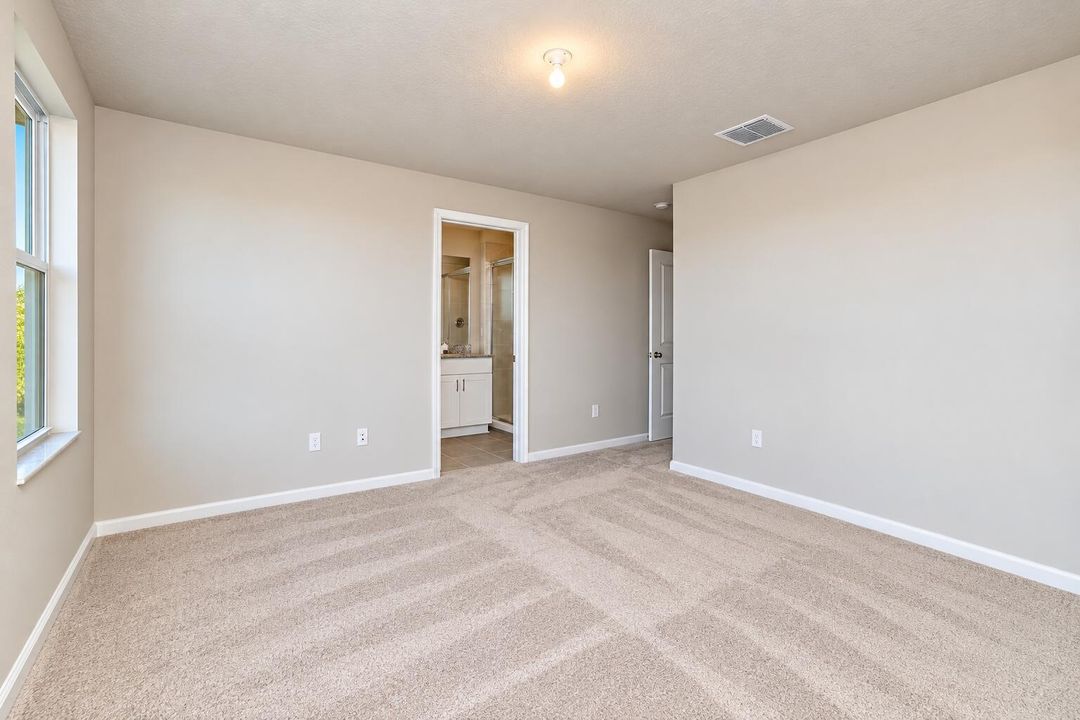 Empty Modern Bedroom with Bathroom View