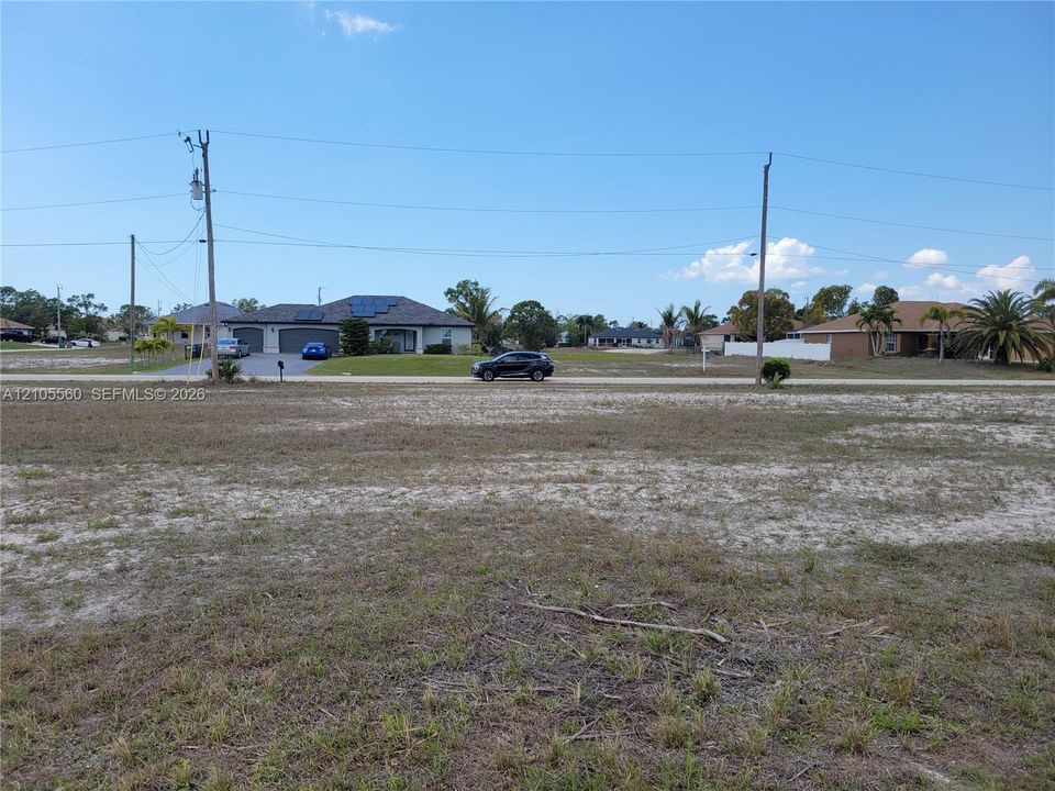 Expansive level lot featuring cleared terrain and established perimeter vegetation
