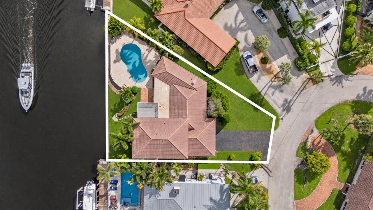 Aerial Waterfront Estate with Pool
