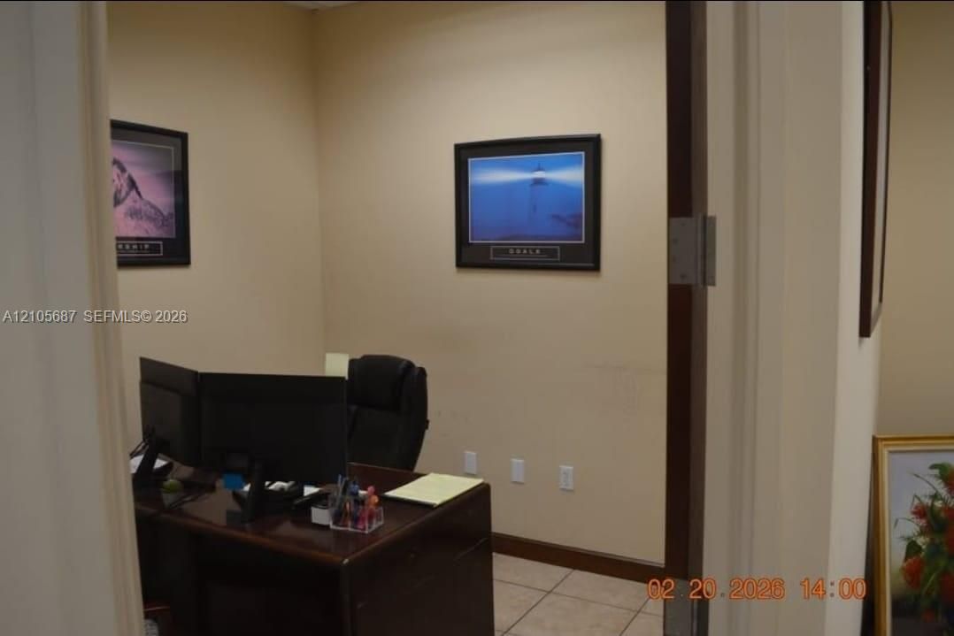 Interior room featuring neutral wall paint and tile flooring