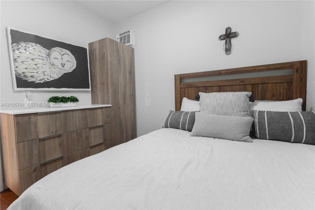Wood-finish cabinetry featuring clean lines and a neutral top surface