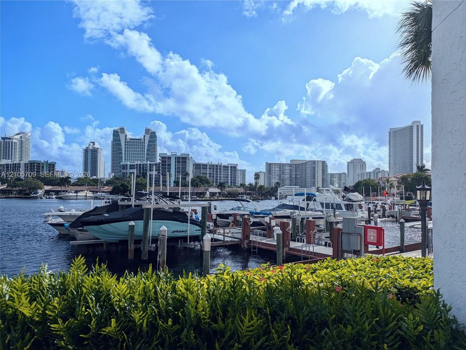 Waterfront property featuring a private deep-water dock, integrated piling system, manicured landscaping, and bulkhead retaining wall