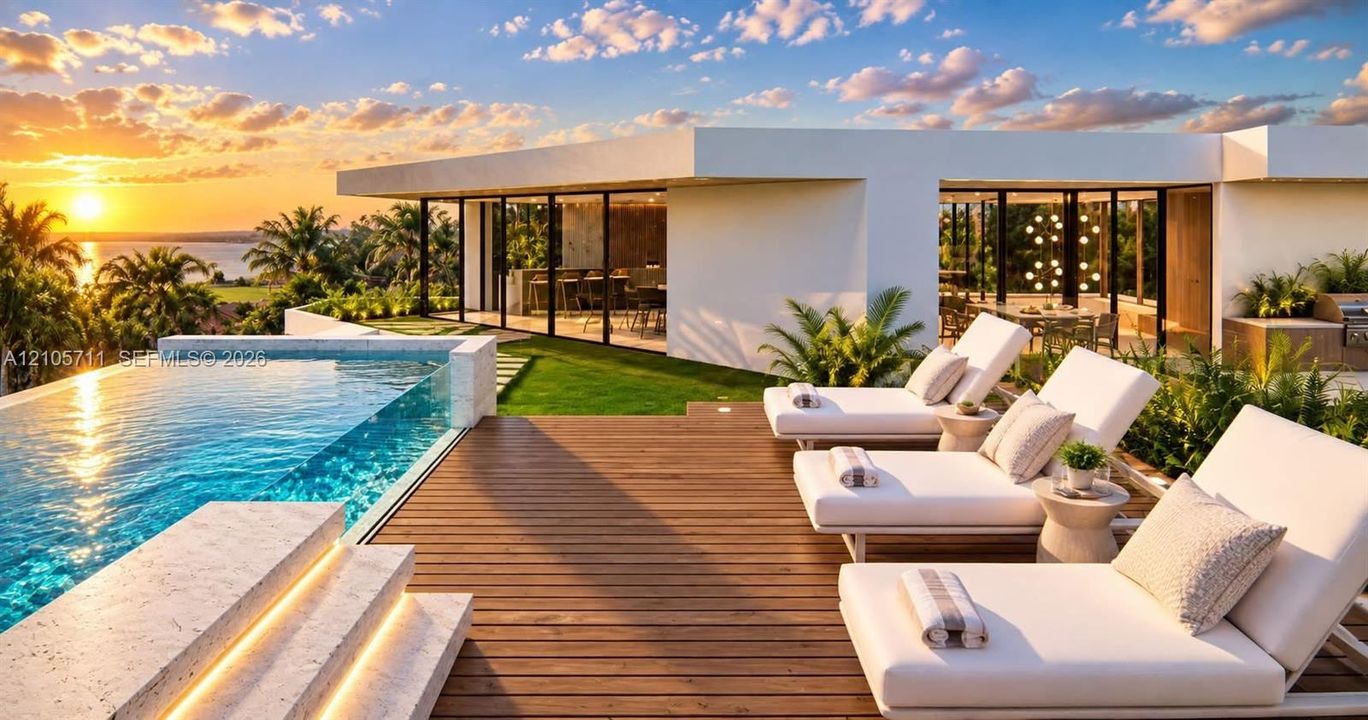 Infinity-edge pool with stone surround, expansive wood-finish deck, floor-to-ceiling glass wall systems, and built-in outdoor kitchen, set against a waterfront sunset backdrop