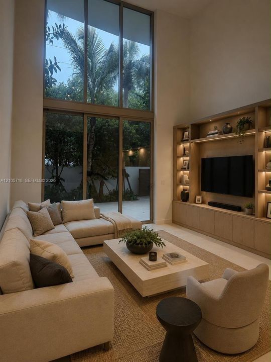 Double-height ceiling, floor-to-ceiling windows, and custom built-in wood shelving featuring integrated lighting