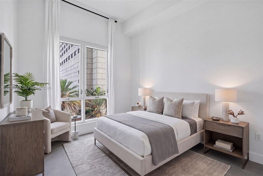 High ceilings, tall multi-pane windows, and neutral interior finishes