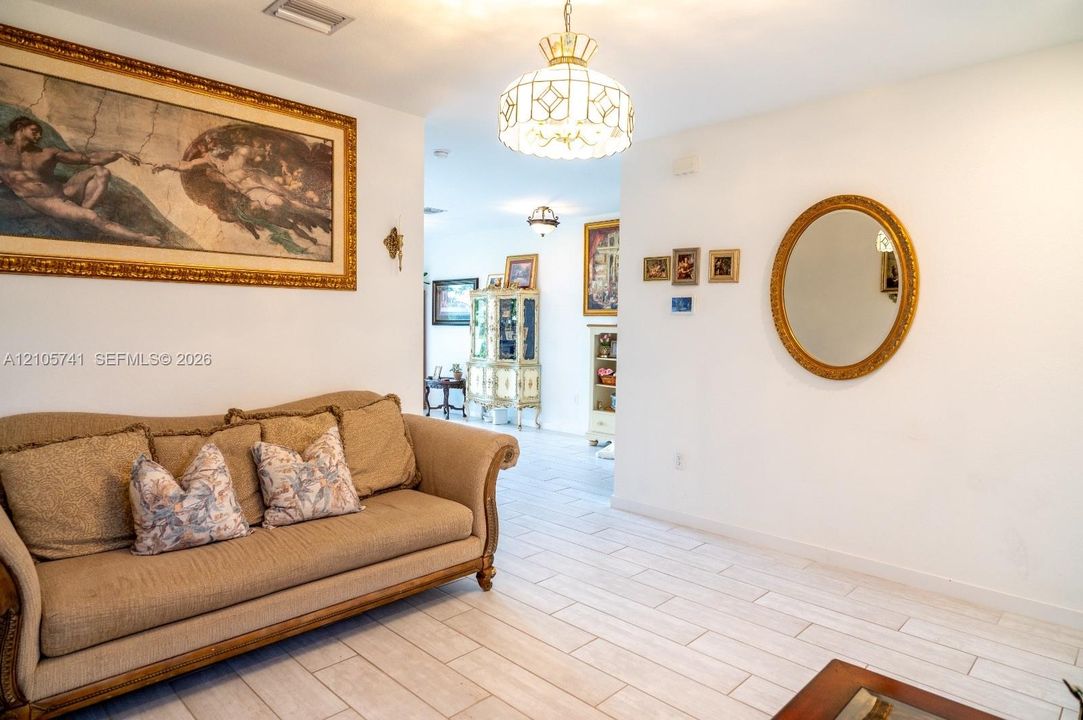 Light-toned tile flooring and decorative globe-style pendant lighting