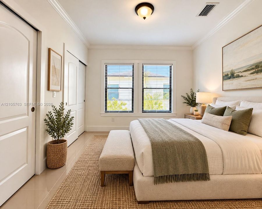 Neutral wall palette with crown molding, double-pane windows with horizontal blinds, polished tile flooring, and multi-panel interior doors
