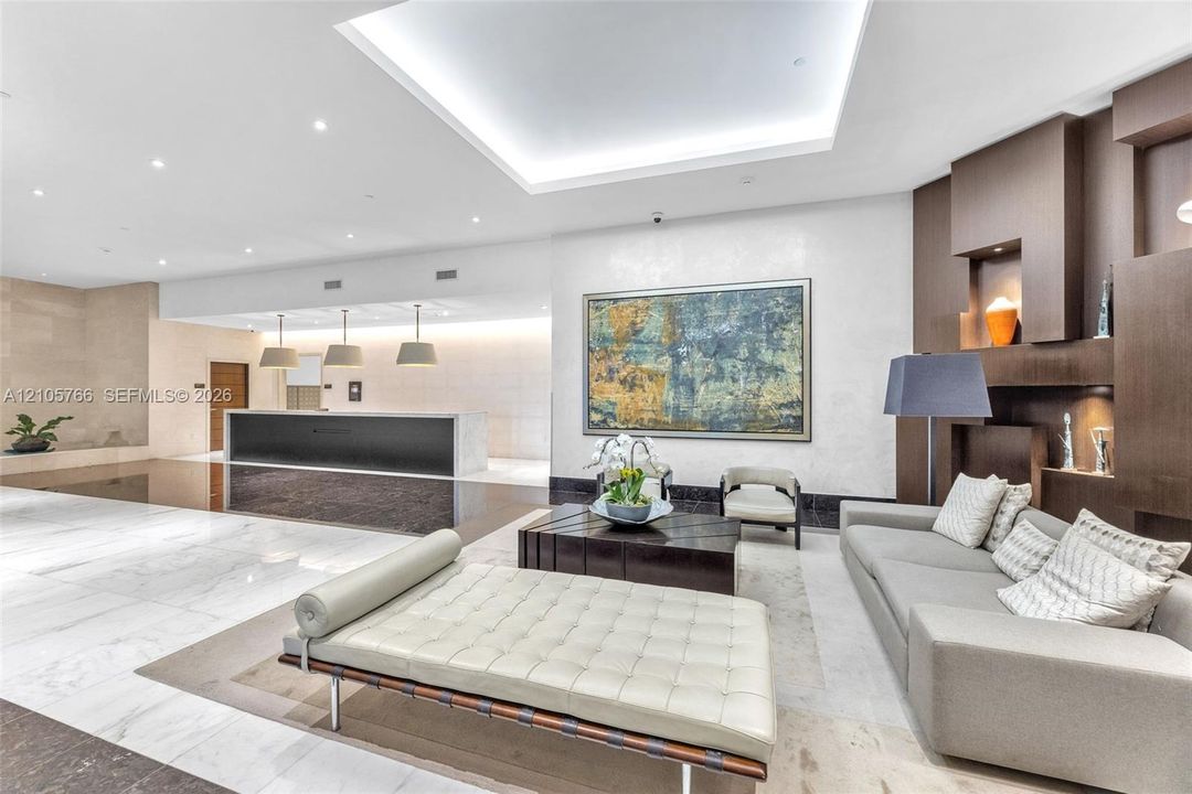 Residents' lobby with the front desk and a seating area.
