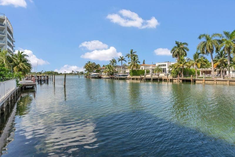 Waterfront property featuring private timber boat docks, bulkheading, and tropical landscaping