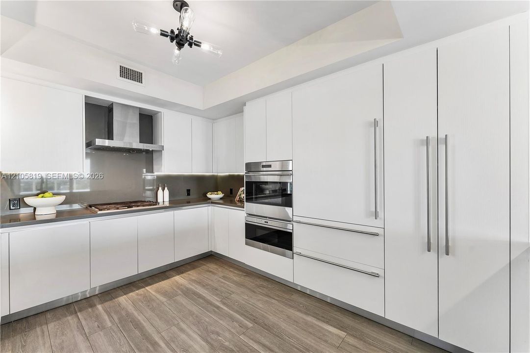 Chef's Kitchen with Wolf Gas Cooktop, Sub-Zero Fridge, Wine Cooler and lots of Storage.