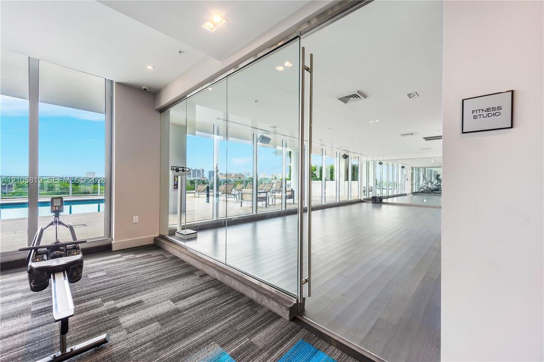 Fitness Studio with Weekly YOGA Classes.  Complete with mats, bands, blocks, straps and light weights.  Pool & River Views.