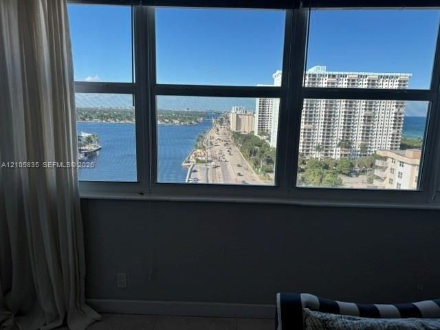 Large-pane multi-section windows featuring expansive water and coastal scenery