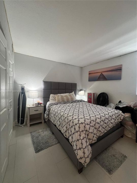 Neutral-toned tile flooring and double-panel doors
