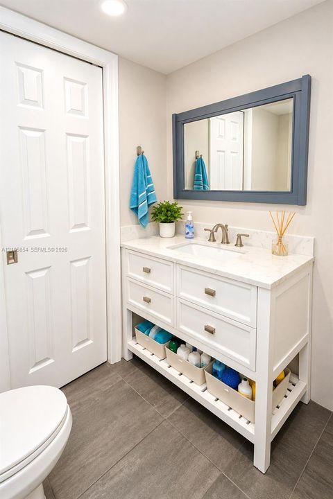 A first floor full bathroom next to a bedroom provide flexibility for guests, family, or a home office