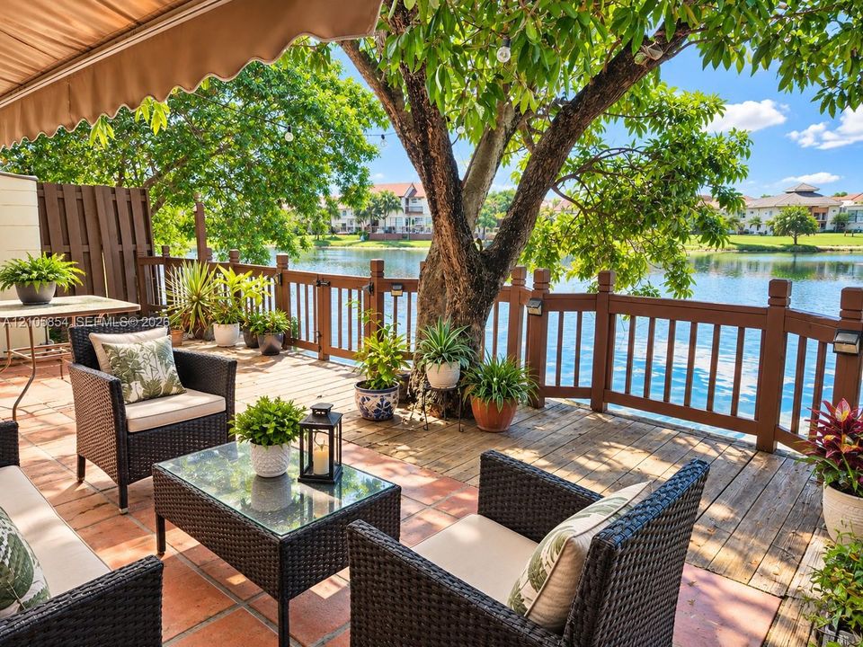 Paved patio and lakefront deck, perfect for outdoor dining, entertaining, or relaxing while enjoying peaceful water views.