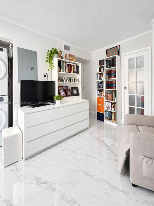 A first-floor bedroom and full bathroom provide flexibility for guests, family, or a home office