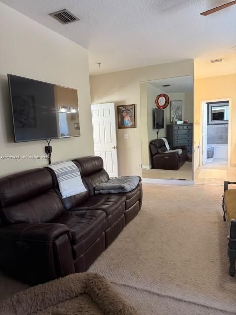 Full-height wall-mounted mirror, neutral wall-to-wall carpeting, and six-panel interior doors